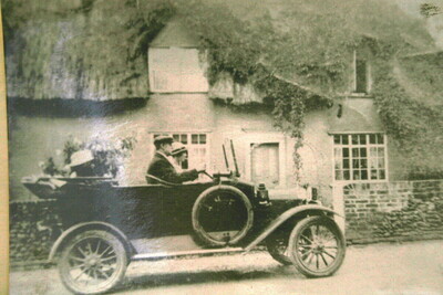 outside Spencer Coes cottage 1920s